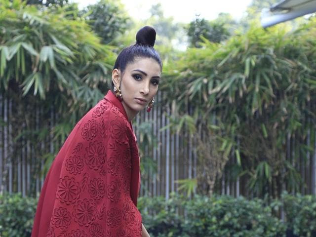 Model Ashanti Asha in a sheer red maxi with embellishments, paired with a smart jacket by Namrata Joshipura.(Waseem Gashroo/HT Photo, Shara Ashraf/Concept and Styling) Model Ashanti Asha in a sheer red maxi with embellishments, paired with a smart jacket by Namrata Joshipura.(Waseem Gashroo/HT Photo, Shara Ashraf/Concept and Styling)