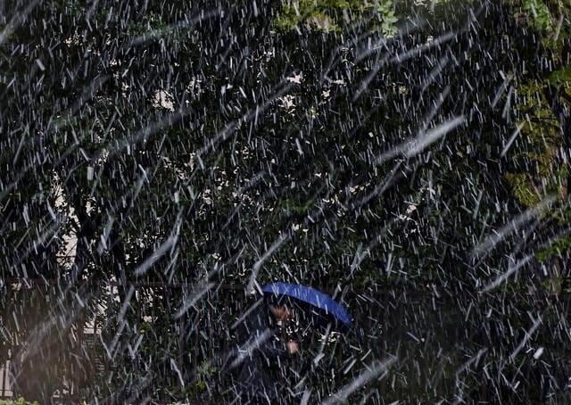 An unusually cold air mass brought wet snow to Japan's capital. (AP Photo) An unusually cold air mass brought wet snow to Japan's capital. (AP Photo)