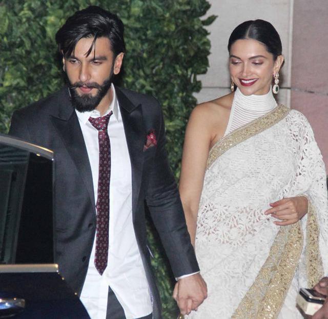 Deepika wore a gorgeous white Rohit Bal saree with her hair tied in a neat bun while Ranveer opted for a safe, sleek black suit. (HT Photos/Yogen Shah) Deepika wore a gorgeous white Rohit Bal saree with her hair tied in a neat bun while Ranveer opted for a safe, sleek black suit. (HT Photos/Yogen Shah)