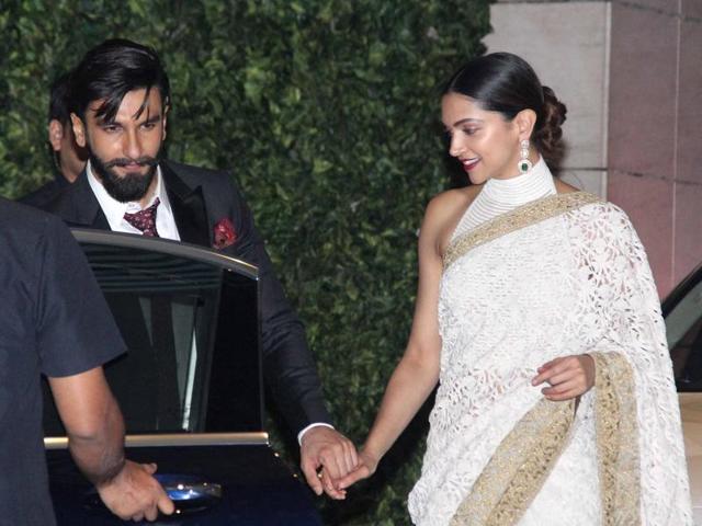 The two were spotted holding hands as they were leaving the Ambanis’ party together. Ranveer was seen escorting Deepika to a car with her hand clenched tightly in his. (HT Photos/Yogen Shah) The two were spotted holding hands as they were leaving the Ambanis’ party together. Ranveer was seen escorting Deepika to a car with her hand clenched tightly in his. (HT Photos/Yogen Shah)