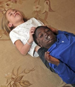 Dunia Sibomana, 9, right, plays with Annabelle Chaix, 9, at their house in the Brooklyn borough of New York. (AP) Dunia Sibomana, 9, right, plays with Annabelle Chaix, 9, at their house in the Brooklyn borough of New York. (AP)