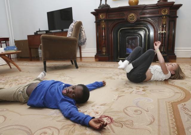 Dunia Sibomana, 9, left, plays with Annabelle Chaix, 9, at their house in the Brooklyn borough of New York. (AP) Dunia Sibomana, 9, left, plays with Annabelle Chaix, 9, at their house in the Brooklyn borough of New York. (AP)