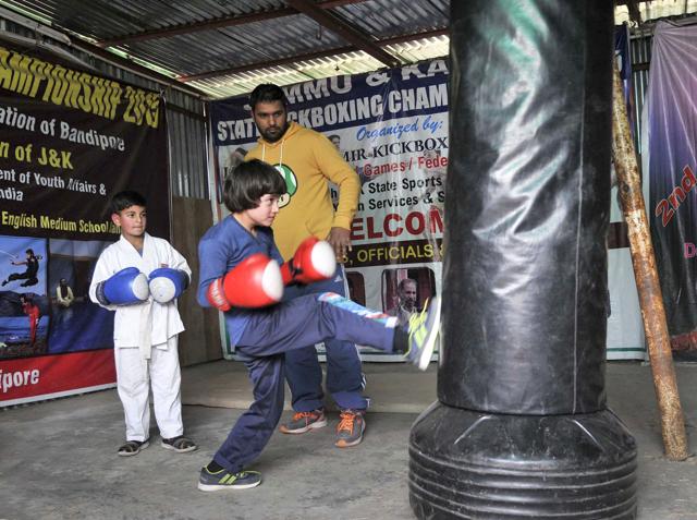 Tajamul Islam and Hashim Peerzada practice martial arts with their coach Faisal Ali at the academy. (Waseem Andrabi/HT Photo) Tajamul Islam and Hashim Peerzada practice martial arts with their coach Faisal Ali at the academy. (Waseem Andrabi/HT Photo)