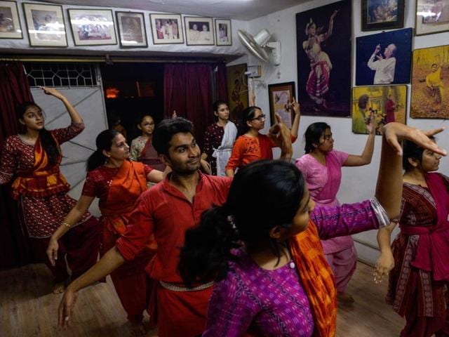 Students elegantly curve their hands before breaking into synchronised footwork at a class in New Delhi, where growing numbers are signing up for Indian traditional dance classes rooted in Hindu mythology. (AFP) Students elegantly curve their hands before breaking into synchronised footwork at a class in New Delhi, where growing numbers are signing up for Indian traditional dance classes rooted in Hindu mythology. (AFP)