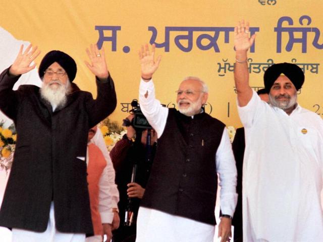 Prime Minister Narendra Modi, Punjab CM Parkash Singh Badal and deputy CM Sukhbir Singh Badal wave at the crowd during a rally organised for the laying of foundation stone of All India Institute of Medical Sciences (AIIMS) in Bathinda on Friday. (PTI) Prime Minister Narendra Modi, Punjab CM Parkash Singh Badal and deputy CM Sukhbir Singh Badal wave at the crowd during a rally organised for the laying of foundation stone of All India Institute of Medical Sciences (AIIMS) in Bathinda on Friday. (PTI)