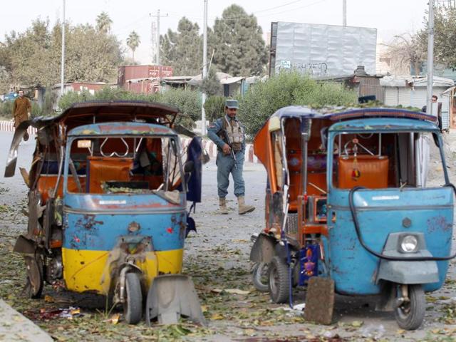 An Afghan policeman stands guard at the site of blast in Jalalabad city, Afghanistan on Friday. (REUTERS) An Afghan policeman stands guard at the site of blast in Jalalabad city, Afghanistan on Friday. (REUTERS)