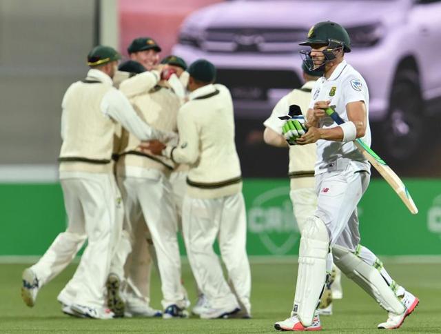 South Africa captain Faf du Plessis (R) walks back to the pavilion as Australia's players celebrate after dismissing him during the third day of the third Test at the Adelaide Oval on Saturday. (AFP) South Africa captain Faf du Plessis (R) walks back to the pavilion as Australia's players celebrate after dismissing him during the third day of the third Test at the Adelaide Oval on Saturday. (AFP)