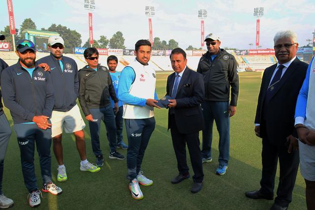 Karun Nair was handed his Test cap by Sunil Gavaskar as he made his debut in the Mohali game against England. (BCCI) Karun Nair was handed his Test cap by Sunil Gavaskar as he made his debut in the Mohali game against England. (BCCI)