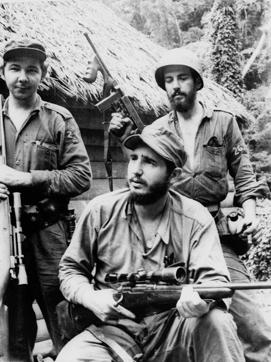 In this March 14, 1957 file photo, Fidel Castro, the young anti-Batista guerrilla leader, centre, is seen with his brother Raul Castro, left, and Camilo Cienfuegos, right, while operating in the Mountains of Eastern Cuba. (AP)