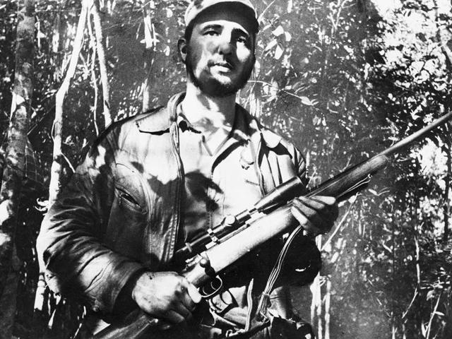 In this February 26, 1957 file photo, Cuba's leader Fidel Castro stands in an unknown location in Cuba.  (AP) 