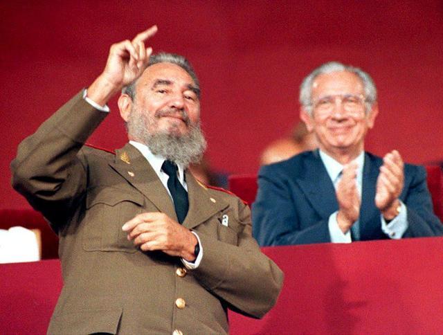 Fidel Castro (L) waves to the Cuban Olympic delegation as they pass the reviewing stand during the opening ceremony of the Summer Olympics on July 24, 1992 . (AFP) Fidel Castro (L) waves to the Cuban Olympic delegation as they pass the reviewing stand during the opening ceremony of the Summer Olympics on July 24, 1992 . (AFP)