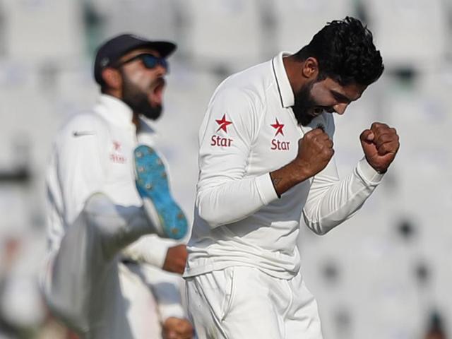 India captain Virat Kohli (left) will be hoping his spinners, Ravindra Jadeja, Jayant Yadav and Ravichandran Ashwin, will bowl out England early into Day 2 in Mohali.(AP)