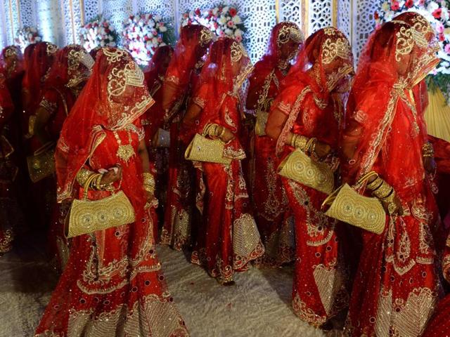 Brides arrive for a mass marriage in Mumbai on November 23, 2016. Twenty two couples were wed in the ceremony organised to help economically backward families who otherwise cannot afford to pay for a wedding. (Indranil Mukherjee/AFP) Brides arrive for a mass marriage in Mumbai on November 23, 2016. Twenty two couples were wed in the ceremony organised to help economically backward families who otherwise cannot afford to pay for a wedding. (Indranil Mukherjee/AFP)