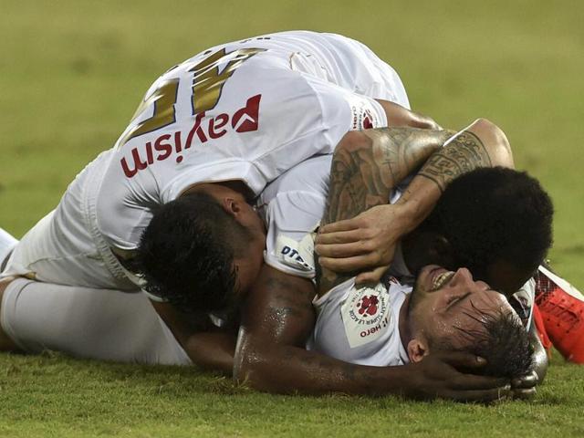 North East United FC players celebrate after scoring the equaliser to tie the match 3-3 against Chennaiyin FC during their Indian Super League (ISL) match at Jawaharlal Nehru Stadium in Chennai on Saturday.(PTI)