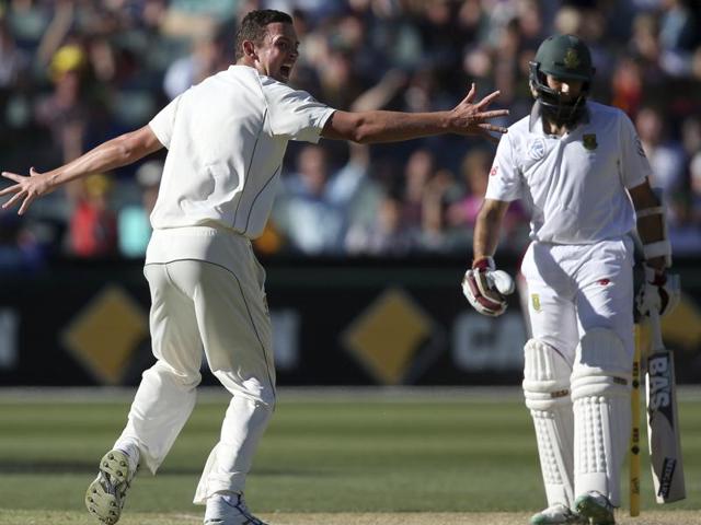 Australia's Josh Hazlewood (left) celebrates the wicket of South Africa's Hashim Amla during the third day of the day-night Test at Adelaide Oval. Amla fell after edging a Hazlewood away swinger.(AP) Australia's Josh Hazlewood (left) celebrates the wicket of South Africa's Hashim Amla during the third day of the day-night Test at Adelaide Oval. Amla fell after edging a Hazlewood away swinger.(AP)