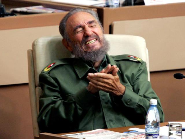 Then Cuban President Fidel Castro laughs during the year-end session of the Cuban parliament in Havana in this December 23, 2005 file photo.  (REUTERS) 