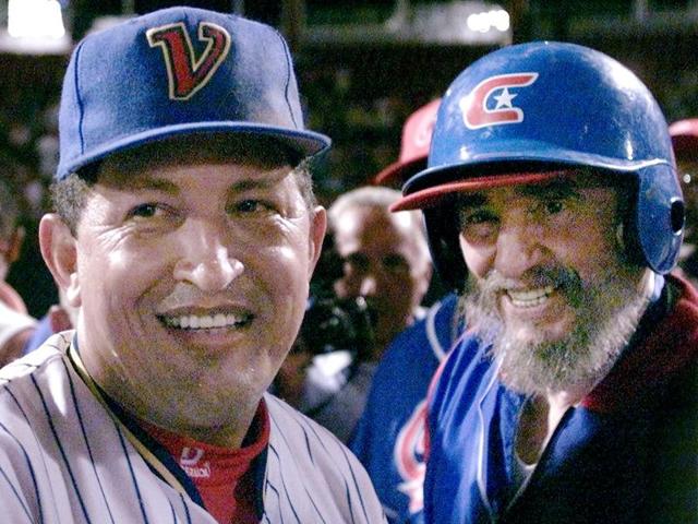 Then Cuban President Fidel Castro (R) and his Venezuelan counterpart Hugo Chavez chat on the field after taking part in a friendly baseball game between their two countries at the Barquisimeto baseball stadium in this October 29, 2000 file photo.  (REUTERS) 
