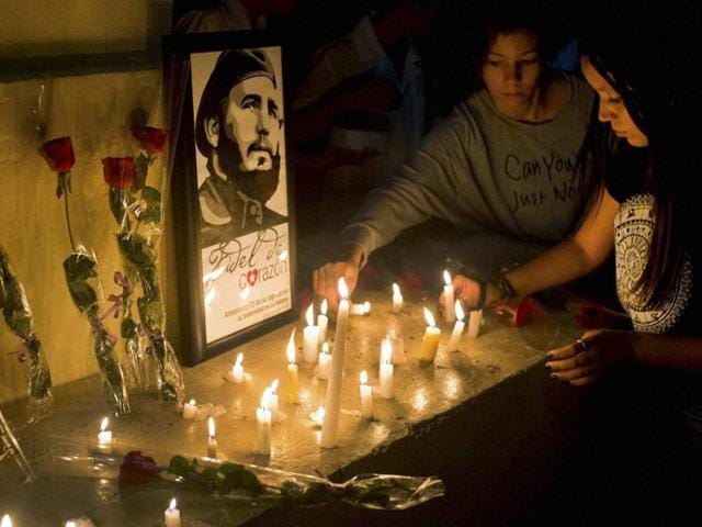 Students place candles around an image of the late Cuban leader Fidel Castro, at the university where Castro studied law, in Havana, Cuba, on Saturday. (AP Photo) Students place candles around an image of the late Cuban leader Fidel Castro, at the university where Castro studied law, in Havana, Cuba, on Saturday. (AP Photo)