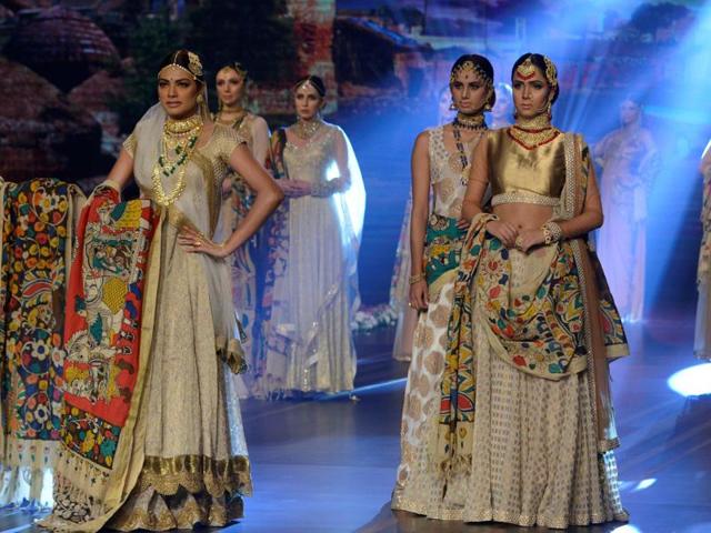 Models showcasing bridal looks created by Iqbal during the couture week. (AFP) Models showcasing bridal looks created by Iqbal during the couture week. (AFP)