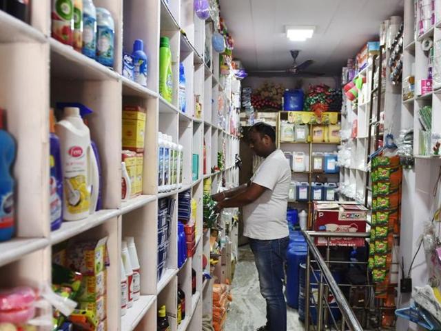 A shopkeeper arranges goods on a shelf inside his shop in New Delhi on August 3, 2016. The government has recommended an ‘anti-profiteering’ clause in the GST law to prevent price rise of commodities. (AFP) A shopkeeper arranges goods on a shelf inside his shop in New Delhi on August 3, 2016. The government has recommended an ‘anti-profiteering’ clause in the GST law to prevent price rise of commodities. (AFP)