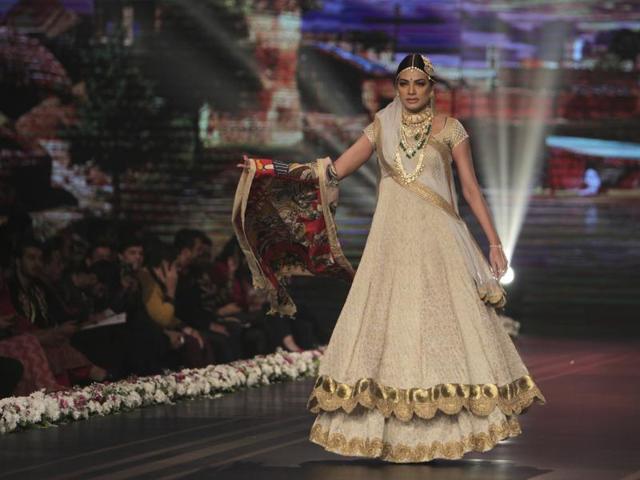 A model presents a bridal creation by designer Anees Malik. (AP) A model presents a bridal creation by designer Anees Malik. (AP)