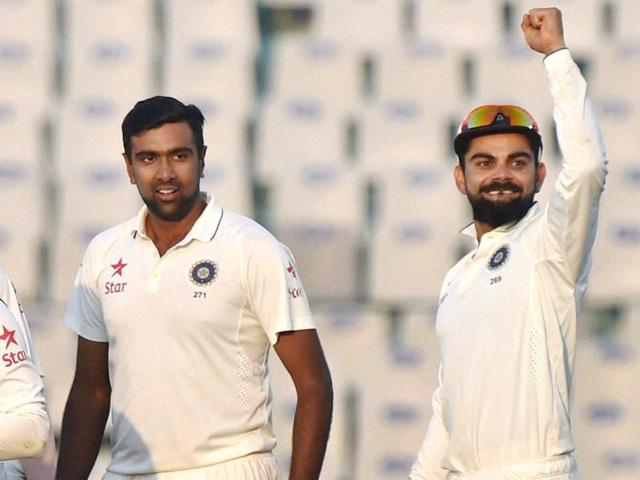 Ravichandran Ashwin celebrates with teammates after dismissing England captain Alastair Cook in Mohali on Monday.(REUTERS) Ravichandran Ashwin celebrates with teammates after dismissing England captain Alastair Cook in Mohali on Monday.(REUTERS)