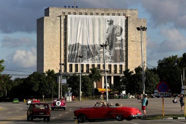 A picture of Cuban former president Fidel Castro hangs in front of the Cuban National Library at Revolution Square in Havana, Cuba. (Reuters) A picture of Cuban former president Fidel Castro hangs in front of the Cuban National Library at Revolution Square in Havana, Cuba. (Reuters)