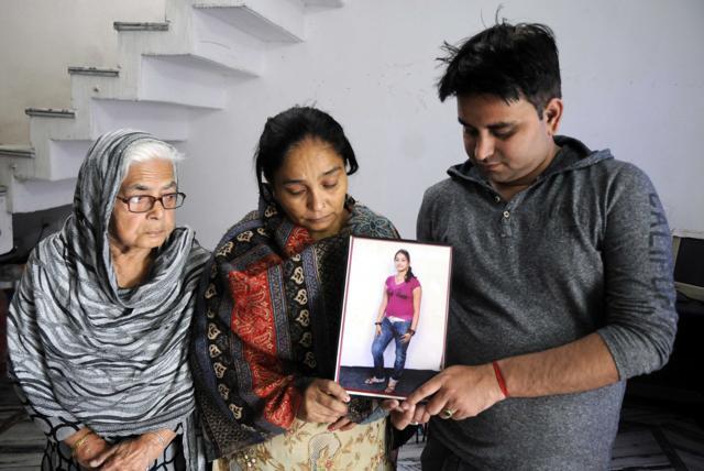 Neha's grandmother, mother and brother holding her photo, in Patiala on Monday. (Bharat Bhushan/HT) Neha's grandmother, mother and brother holding her photo, in Patiala on Monday. (Bharat Bhushan/HT)