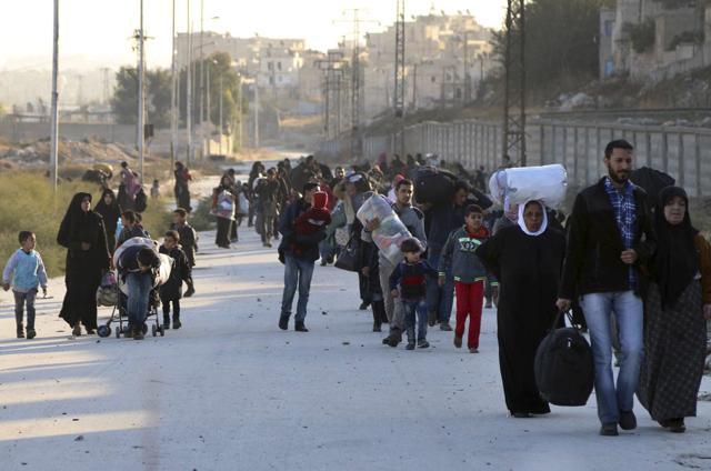 People fleeing rebel-held eastern neighborhoods of Aleppo into the Sheikh Maqsoud area that is controlled by Kurdish fighters. (AP Photo) People fleeing rebel-held eastern neighborhoods of Aleppo into the Sheikh Maqsoud area that is controlled by Kurdish fighters. (AP Photo)