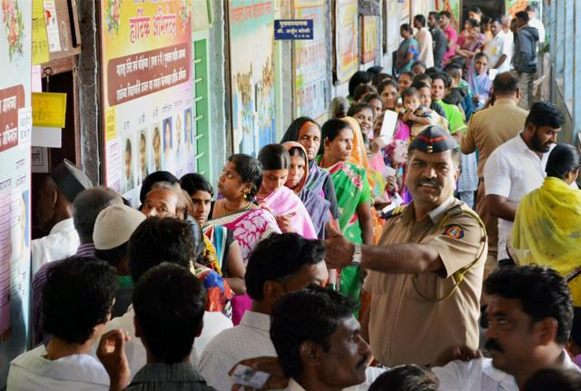 Voters standing in a queue to cast their votes at a polling booth for Municipal Council Elections in Karad on Sunday.(PTI Photo) Voters standing in a queue to cast their votes at a polling booth for Municipal Council Elections in Karad on Sunday.(PTI Photo)