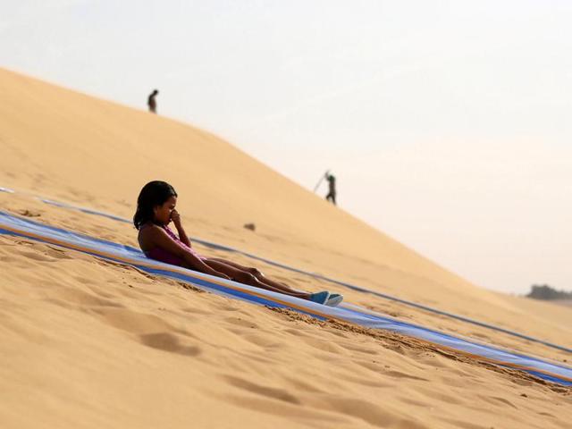The waterfalls here are considered the largest waterfalls in Egypt. A girl slides down a ramp into the lake. (REUTERS) The waterfalls here are considered the largest waterfalls in Egypt. A girl slides down a ramp into the lake. (REUTERS)