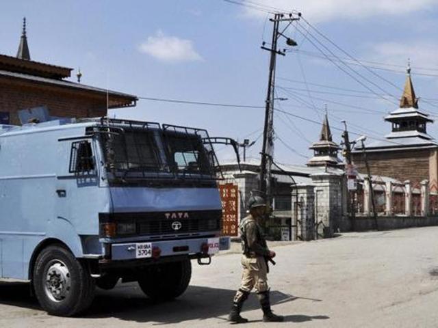 In this file photo, a security jawan stands guard on a desterted street near Jamia Masjid in Srinagar. (PTI) In this file photo, a security jawan stands guard on a desterted street near Jamia Masjid in Srinagar. (PTI)