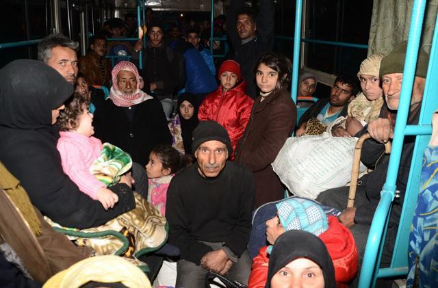 Syrian families, from various eastern districts of Aleppo, are evacuated by bus through Sheikh Maqsud, a Kurdish-controlled enclave between the government-held west of Aleppo and the east, on November 27. (AFP Photo) Syrian families, from various eastern districts of Aleppo, are evacuated by bus through Sheikh Maqsud, a Kurdish-controlled enclave between the government-held west of Aleppo and the east, on November 27. (AFP Photo)