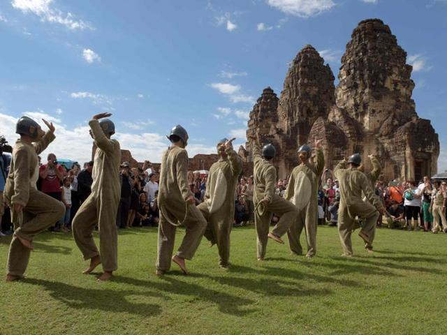 Performers dressed in monkey costumes dance at an ancient temple during the annual "monkey buffet" in Lopburi province, north of Bangkok on November 27. (AFP)