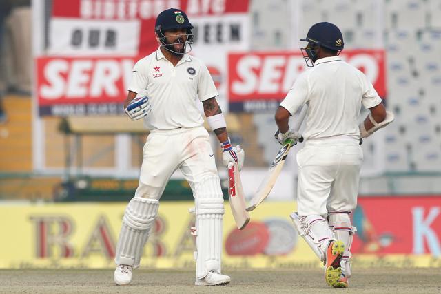 Virat Kohli celebrates with Parthiv Patel as India thrashed England by eight wickets in the Mohali Test against England. (Photo by: Deepak Malik/ BCCI/ SPORTZPICS)