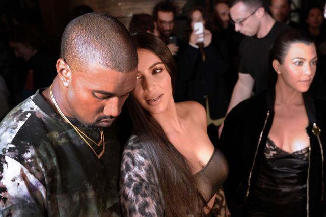 Kanye West with his wife Kim Kardashian (C) and her sister Kourtney Kardashian (R). (AFP) Kanye West with his wife Kim Kardashian (C) and her sister Kourtney Kardashian (R). (AFP)