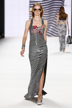 A model walks the runway in a black and white stripes dress with patches. (Frazer Harrison) A model walks the runway in a black and white stripes dress with patches. (Frazer Harrison)