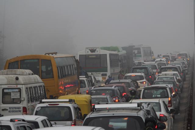 Movement of traffic has slowed down, especially on the Delhi-Noida and Delhi-Gurgaon expressways. Some flights were delayed too. (Burhaan Kinu/ HT Photo)