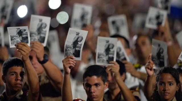 People participate in a massive rally at Revolution Square in Havana in honor of late leader Fidel Castro.  (AFP)