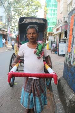 A yarn bombed rickshaw in Kolkata. Many rickshaw pullers wanted their rickshaws to be wrapped in yarn because it was attracting more passengers.