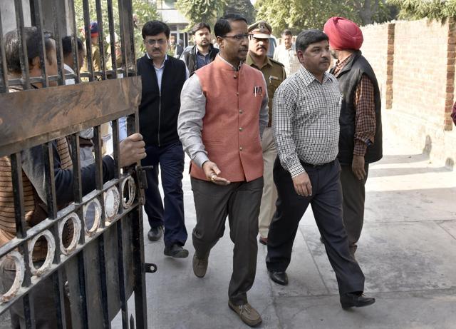 Local bodies minister Anil Joshi (centre) coming out from the victims’ house. (Gurpreet Singh/HT)