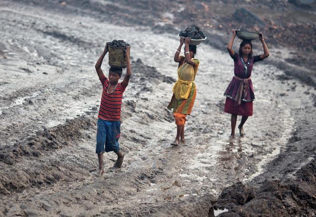 Locals carry coal from an open cast coal field at Dhanbad district in the eastern state of Jharkhand. (Reuters file photo) Locals carry coal from an open cast coal field at Dhanbad district in the eastern state of Jharkhand. (Reuters file photo)