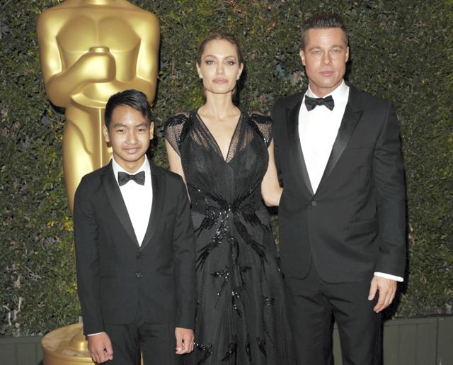 In this Nov. 16, 2013 file photo, Maddox Jolie-Pitt, from left, Angelina Jolie and Brad Pitt attend the 2013 Governors Awards in Los Angeles. (AP) In this Nov. 16, 2013 file photo, Maddox Jolie-Pitt, from left, Angelina Jolie and Brad Pitt attend the 2013 Governors Awards in Los Angeles. (AP)