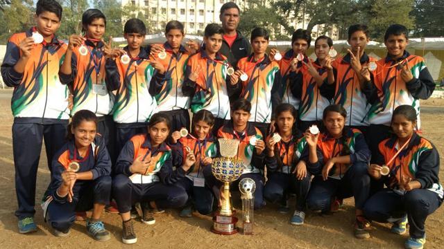 The Chandigarh under-14 football team with the trophy at Sagar, Madhya Pradesh. A majority of the girls in the squad are from Sadalpur village in Hisar. (HT Photo) The Chandigarh under-14 football team with the trophy at Sagar, Madhya Pradesh. A majority of the girls in the squad are from Sadalpur village in Hisar. (HT Photo)