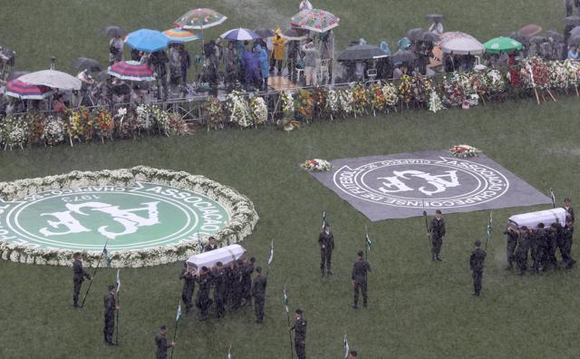 The coffins of victims of the plane crash in Colombia arrive at the Arena Conda stadium in Chapeco, Brazil. (REUTERS) The coffins of victims of the plane crash in Colombia arrive at the Arena Conda stadium in Chapeco, Brazil. (REUTERS)