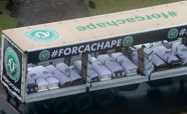 Coffins containing the remains of the victims of the plane crash in Colombia are loaded in a truck after paying tribute to them at Arena Conda stadium in Chapeco, Brazil. (REUTERS) Coffins containing the remains of the victims of the plane crash in Colombia are loaded in a truck after paying tribute to them at Arena Conda stadium in Chapeco, Brazil. (REUTERS)