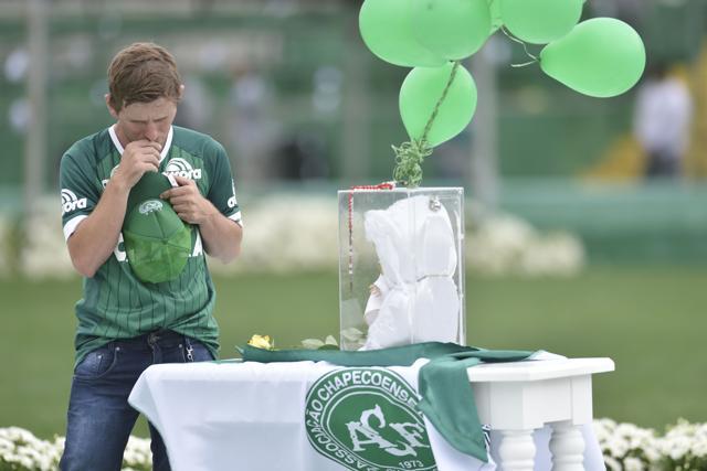A man prays during the funeral of the members of the Chapecoense Real football club team killed in a plane crash in Colombia at the stadium in Chapeco, Santa Catarina, southern Brazil. (AFP) A man prays during the funeral of the members of the Chapecoense Real football club team killed in a plane crash in Colombia at the stadium in Chapeco, Santa Catarina, southern Brazil. (AFP)