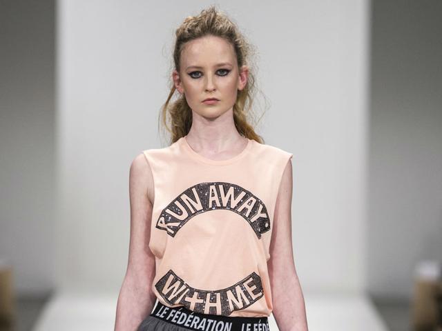 A model walks the ramp in a slogan T-shirt at the New Zealand Fashion Week 2016. (Michael Ng) A model walks the ramp in a slogan T-shirt at the New Zealand Fashion Week 2016. (Michael Ng)