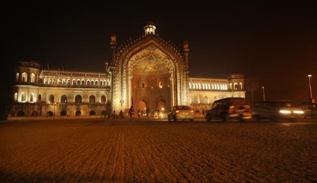 An illuminated Rumi Darwaza, which is a part of the recently renovated heritage street, brings back the old world charm of Awadh. (HT Photo)
