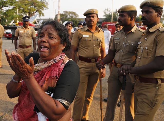 An ‘Amma’ supporter breaks down on seeing the body of Jayalalithaa wrapped in Tricolour at Rajaji Hall in Chennai, where it was kept for public viewing on Tuesday. (AP) An ‘Amma’ supporter breaks down on seeing the body of Jayalalithaa wrapped in Tricolour at Rajaji Hall in Chennai, where it was kept for public viewing on Tuesday. (AP)